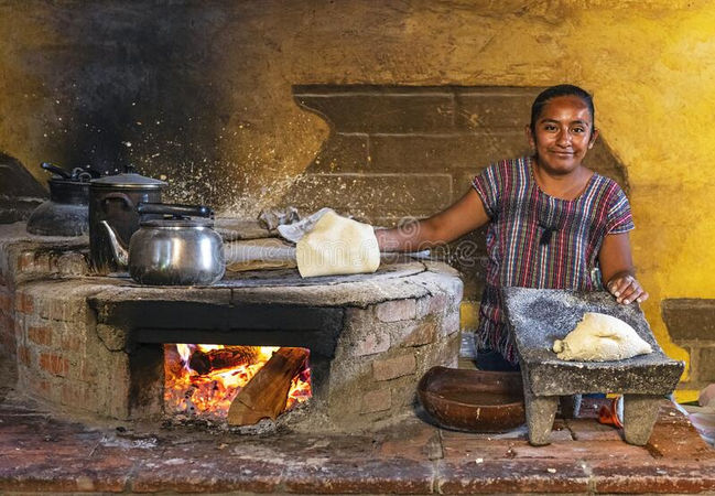 indigenous-woman-cooking-tortilla-oaxaca-mexico-smiling-mexican-corn-pancake-making-tradit