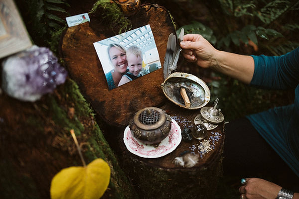 Grief Doula using sacred tools in a healing ritual to guide others through grief and remembrance