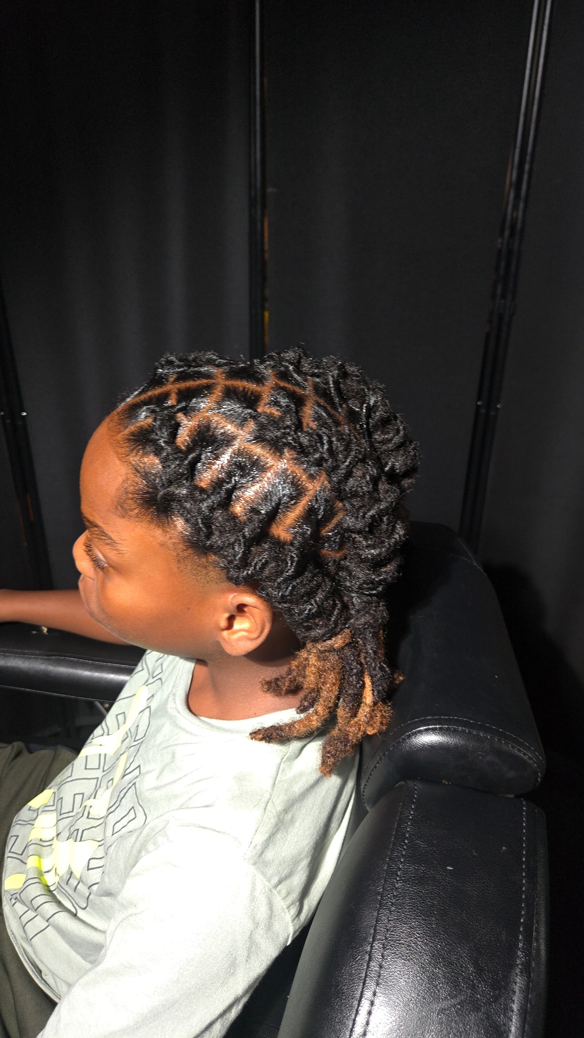 Blessed Handz loc styling with clean geometric parting