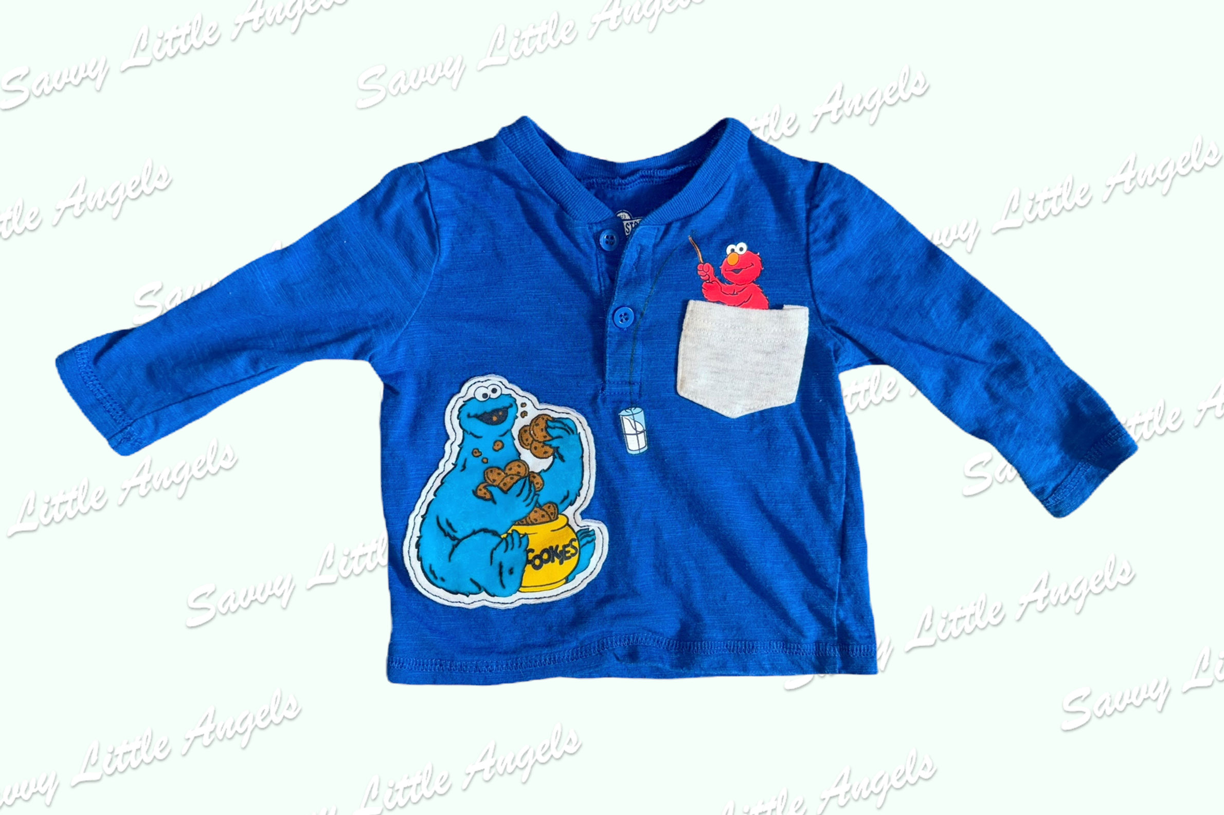 front view of Blue Sesame Street Shirt arms out