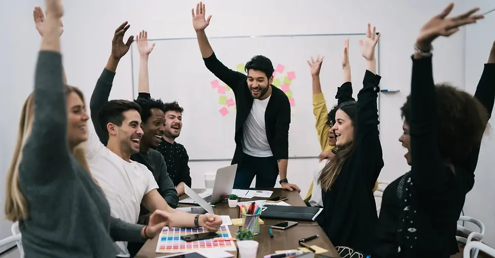 people in an office raising their hands