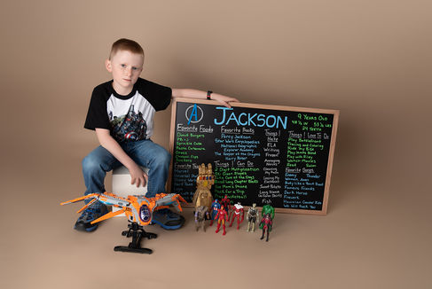 Photo of a little boy with his favorite toys and a list of his favorite things