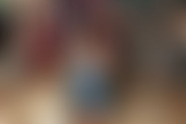 Photo of a little boy in front of a lumberjack background