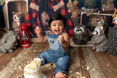 Photo of a little boy in front of a lumberjack background