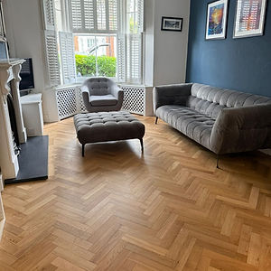Herringbone oak parquet floor installation in a Wimbledon SW19 living room by Howard Naish