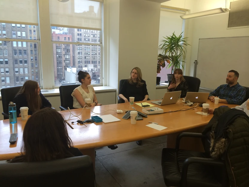 The girls around a conference table at CultHealth ad agency