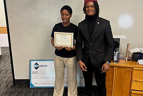 Amoor Consulting Group team member celebrating a sales milestone with a performance certificate and bonus check