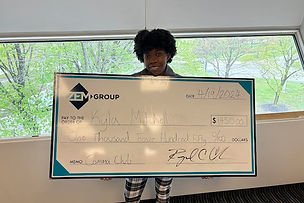 Amoor Consulting Group team member holding a Comma Club bonus check for outstanding sales performance
