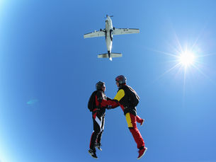 A couple is propelled out of a plan