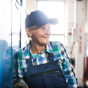A woman takes a break from working a labour job