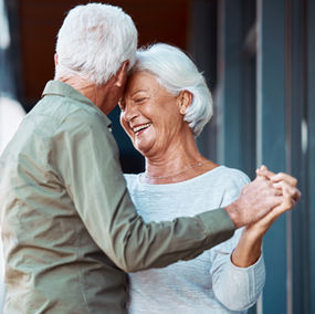 A retired couple dance graceful and exhibit a successful retirement