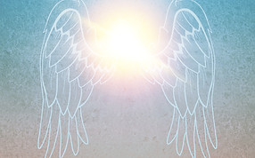 Angels wings framing a dazzling light