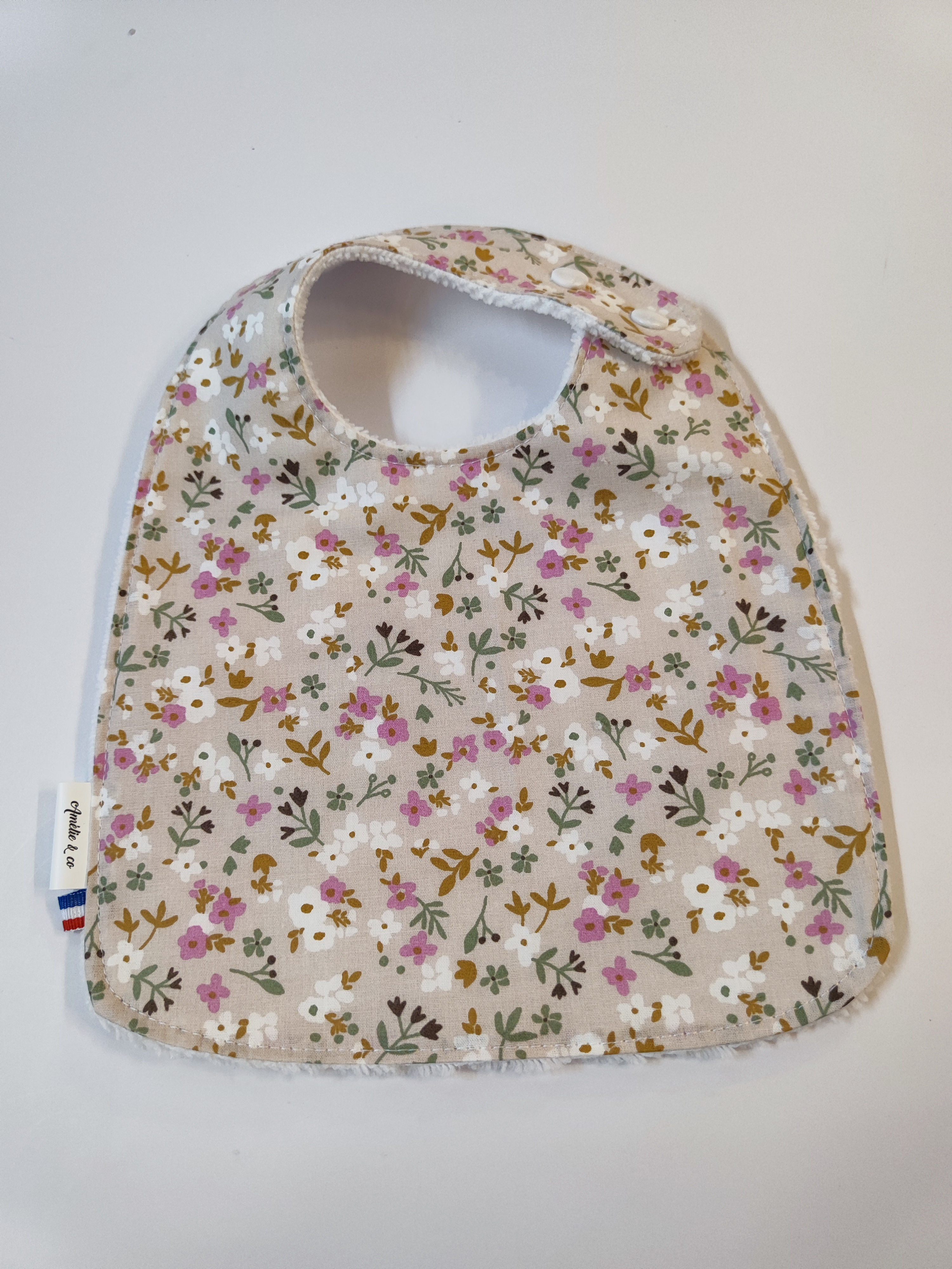 Bavoir 0-18 mois fleuri mauve taupe