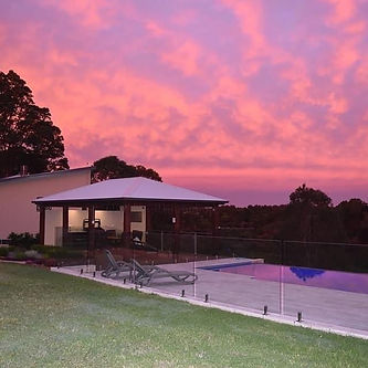 Sunset over the infinity pool at Mapleton Springs adults-only Sunshine Coast Hinterland retreat