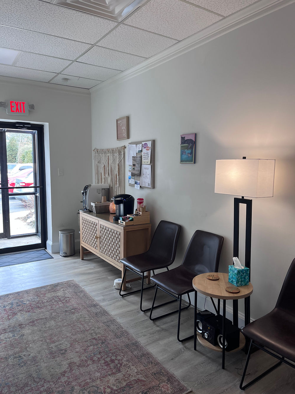 therapy waiting room with chairs and a coffee/tea station