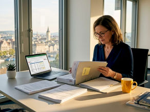 Consultant reviewing Swiss compliance documents