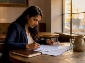 Woman reviewing company incorporation documents in office