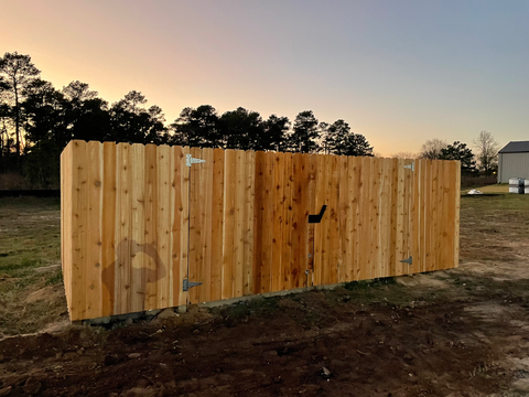 Wooden dumpster enclosure installed at a local church
