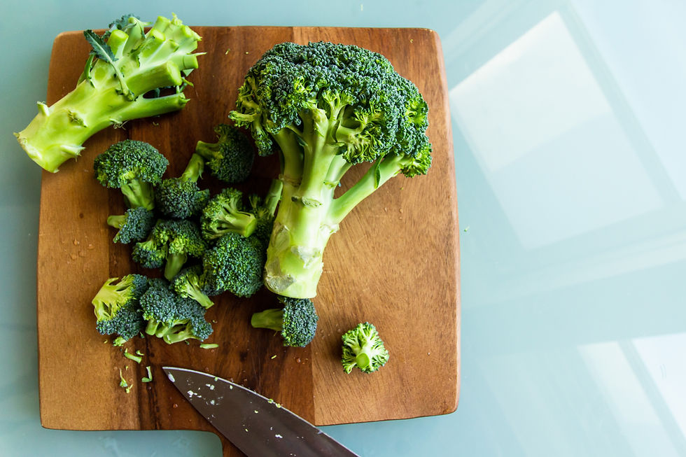 broccoli on a wooden chopping board