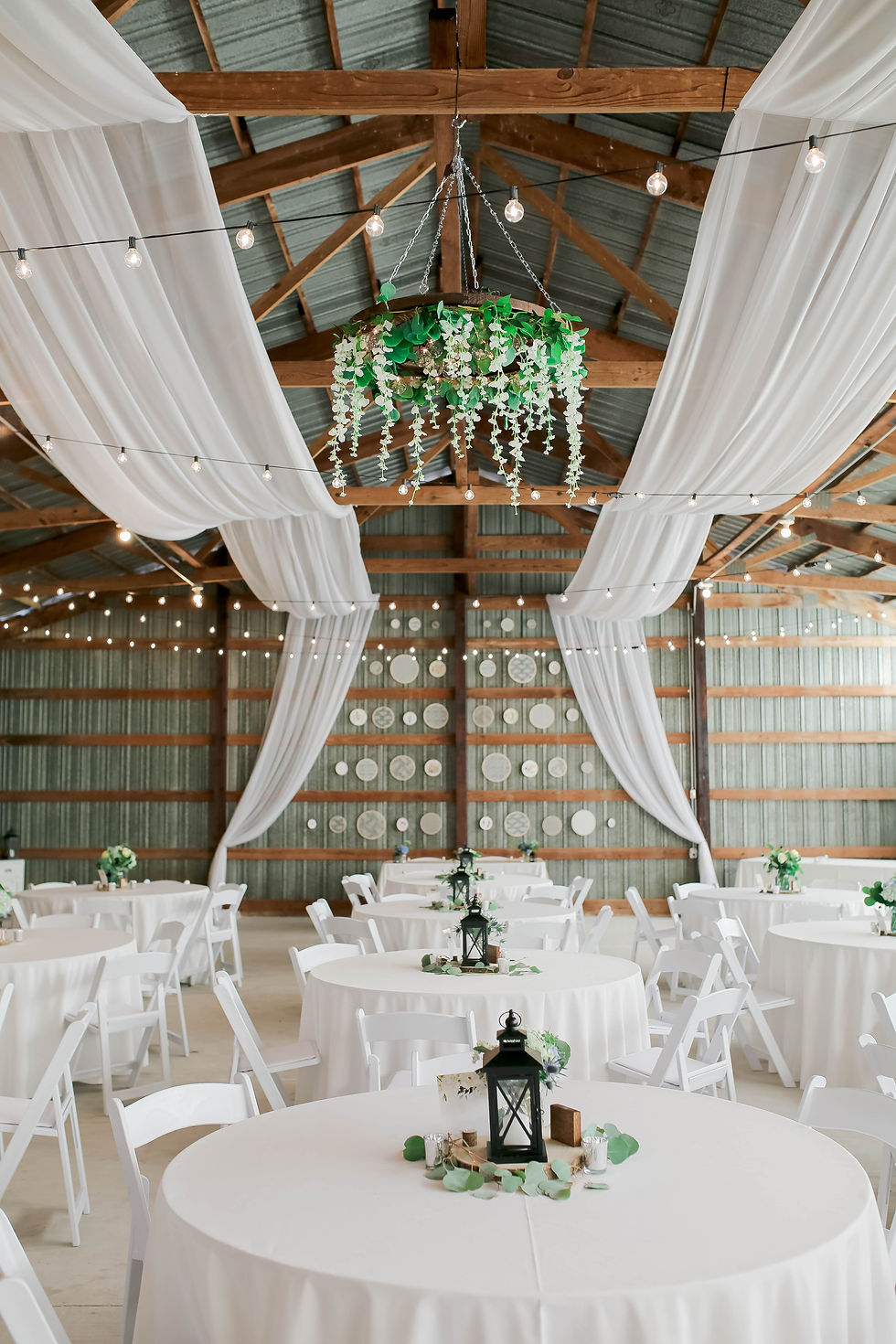 Wedding venue with lush white decorations
