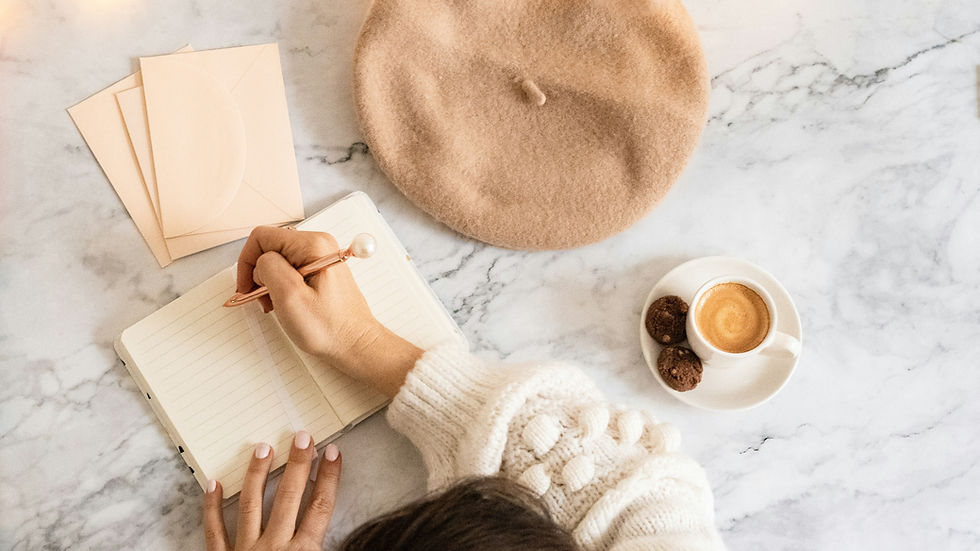Reflecting on personal growth, a woman journals her thoughts over coffee in a serene setting.