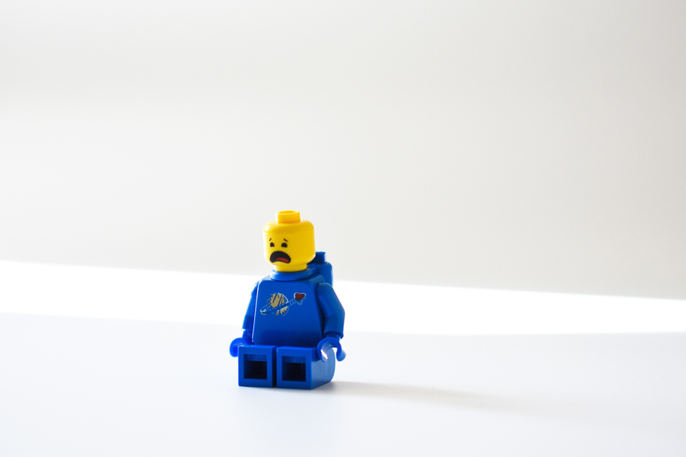 Image of lego figure with unhappy mouth