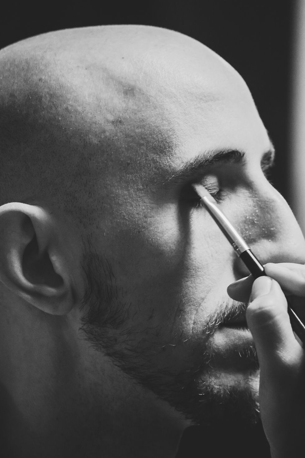 Man having makeup applied
