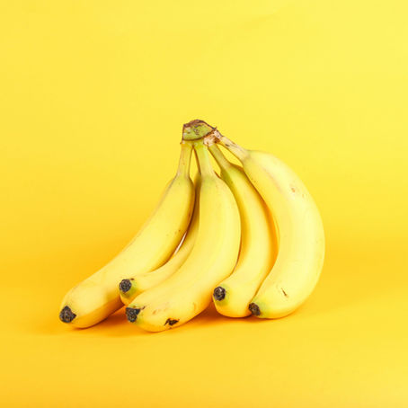 Bananas over a yellow background