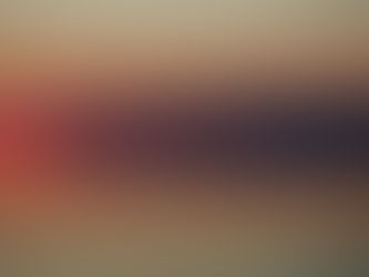 Bird flying over calm water during a vibrant sunset. Sky transitions from orange to pink, reflecting on the serene lake surface. Peaceful mood.