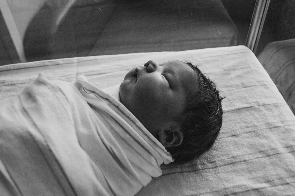 Newborn baby sleeping in crib