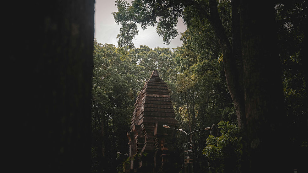 Eye-level view of a tranquil Balinese temple surrounded by lush greenery