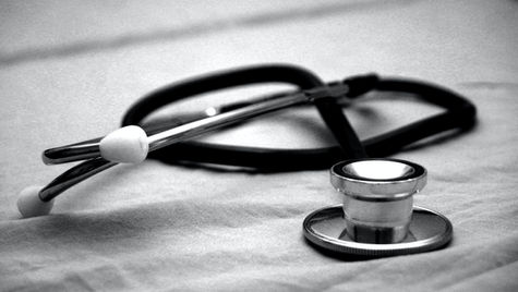 Medical clinic owner reviewing legal documents