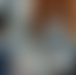 four business people around a table having a tense conversation