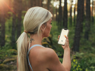 Runner using a phone to manage charity fundraising