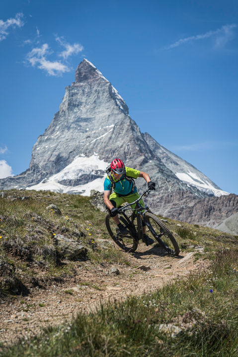 Biker rides through the Zermatt landscape