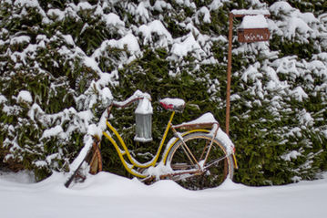 bicycle covered in snow during winter