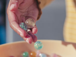 A child playing with water balls