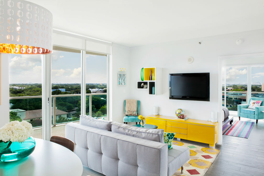 Open-concept living and dining area cleaned with natural light and modern furniture