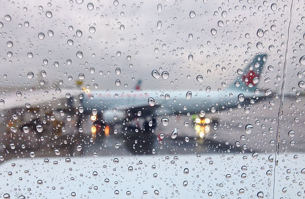 Image of an airplane on a rainy day at JFK airport