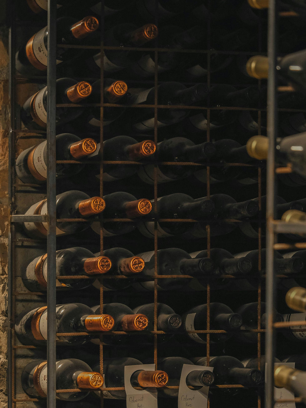 Chilled bottles in racks in a cellar cooling system