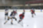 Youth playing hockey