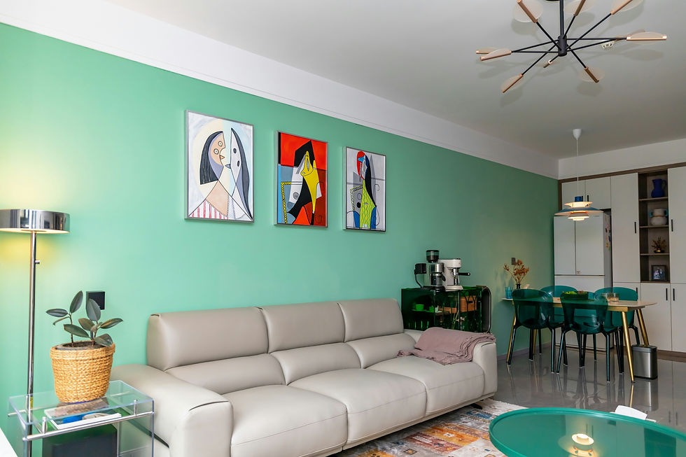 Mint-green living room with beige sofa, abstract art, teal dining chairs, and modern lights in a calm, stylish setting