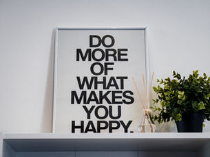 a sign saying do more of what makes you happy