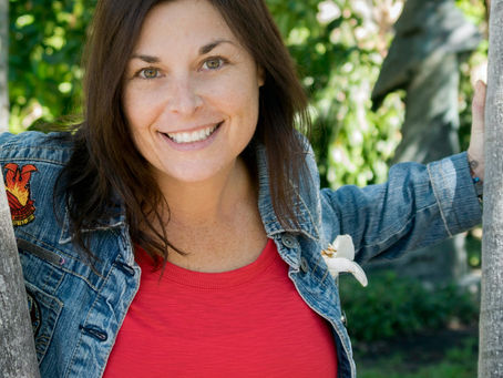 a woman outdoors embracing nature and midlife