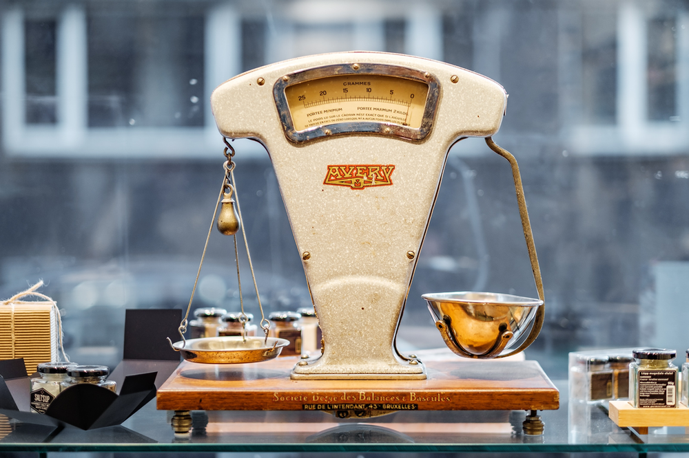 Old fashioned scales on a glass table