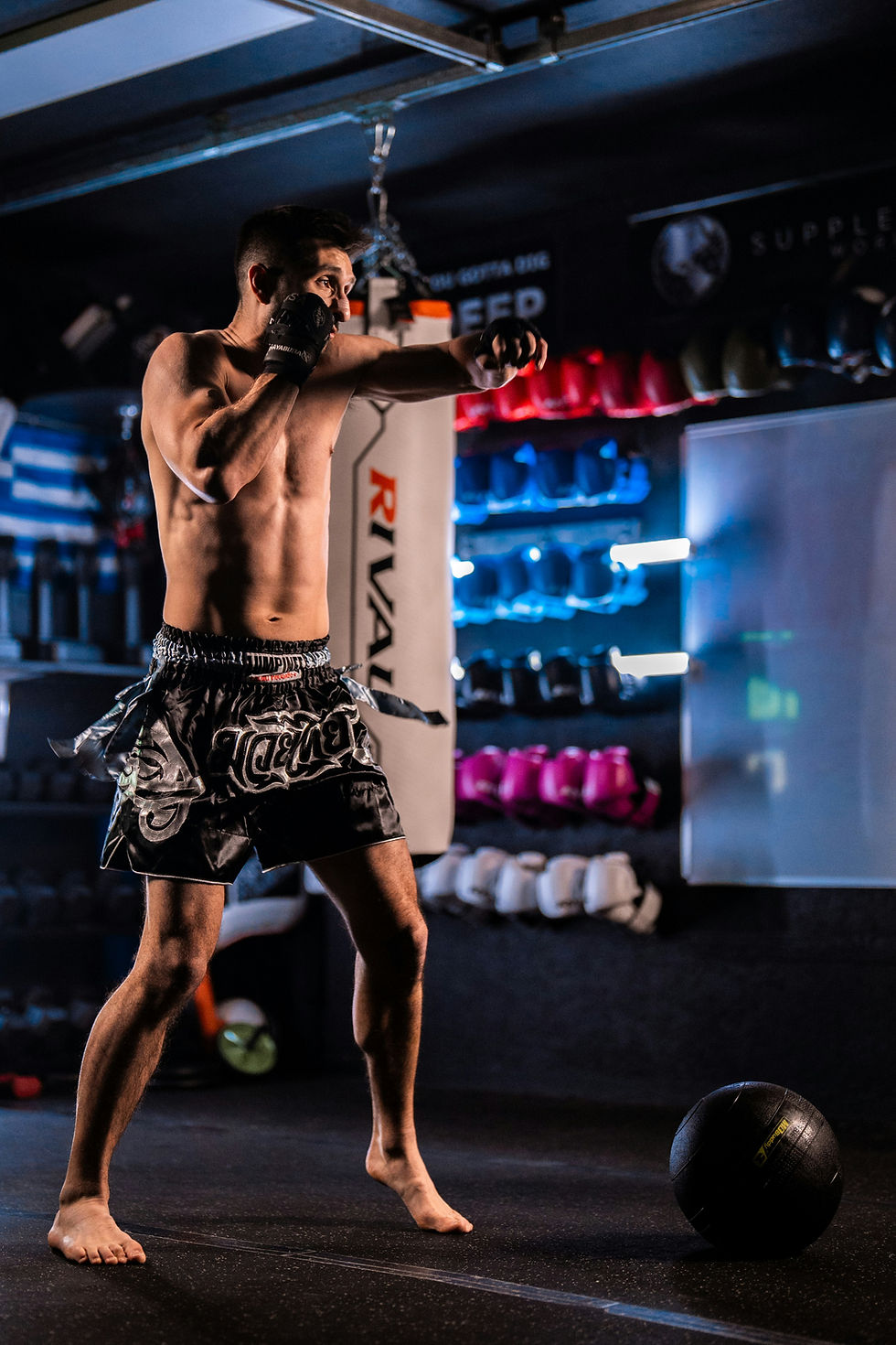 MMA fighter kicking a bag