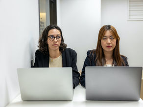 Two people in conflict using body language to express annoyance needing support in communicating. 