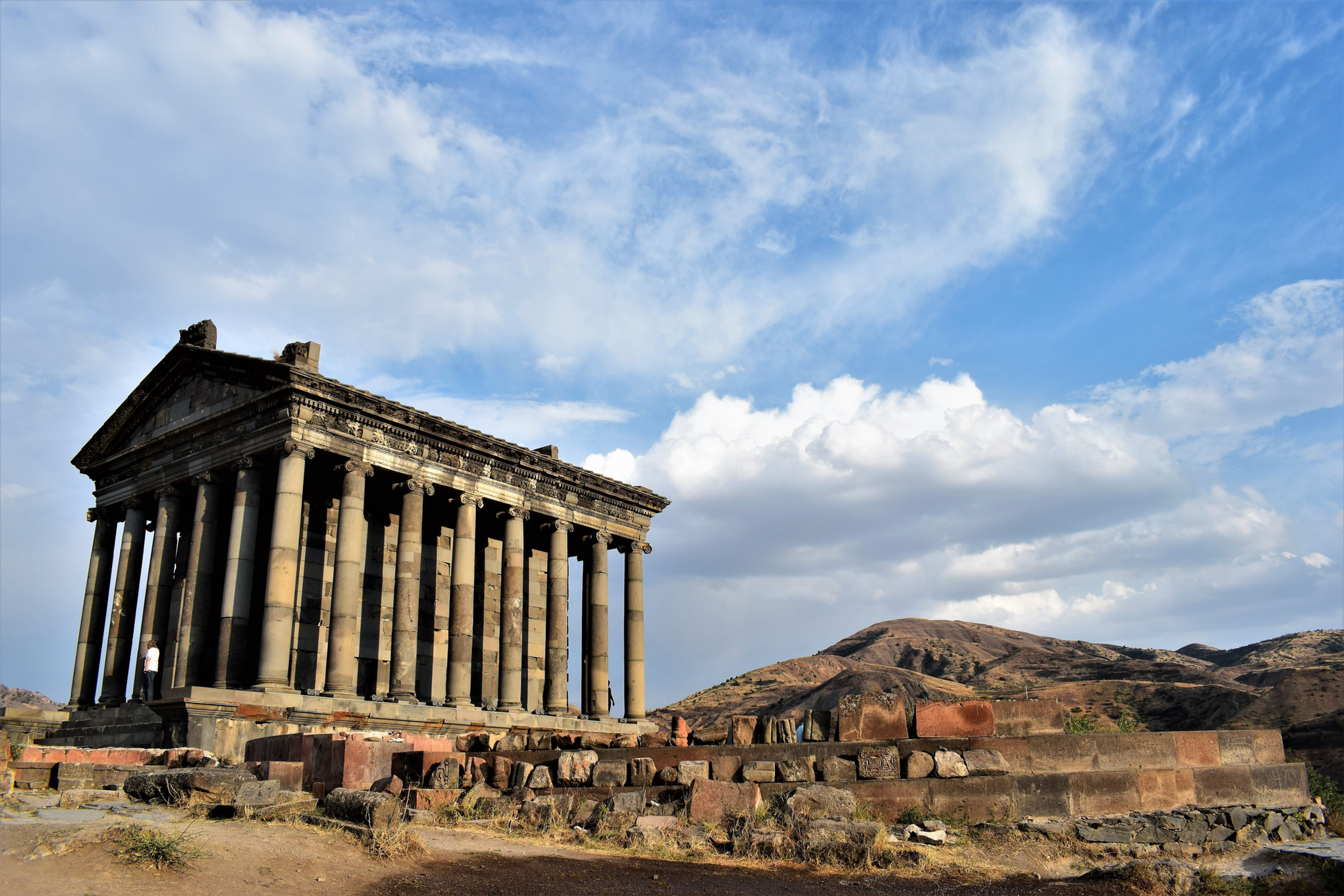 The Temple of Garni in Armenia under a cloudy sky