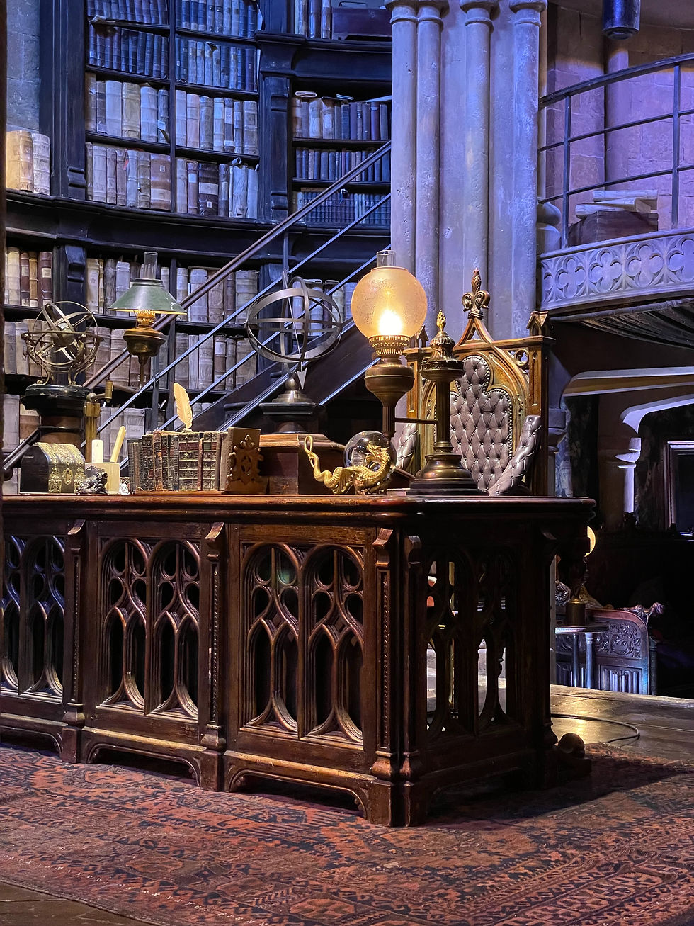 office of a wizarding teacher with various wizard related items about