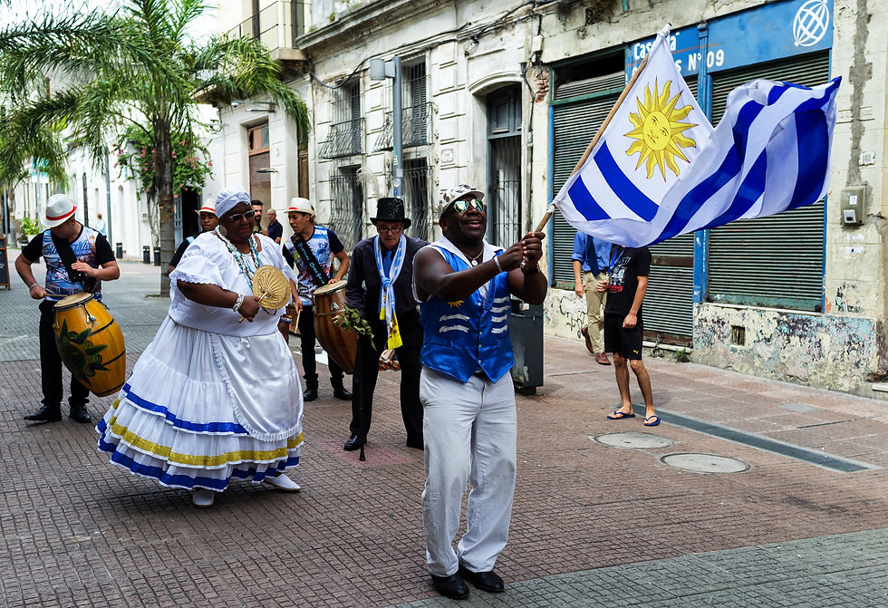 people dancing with uruguayan flag